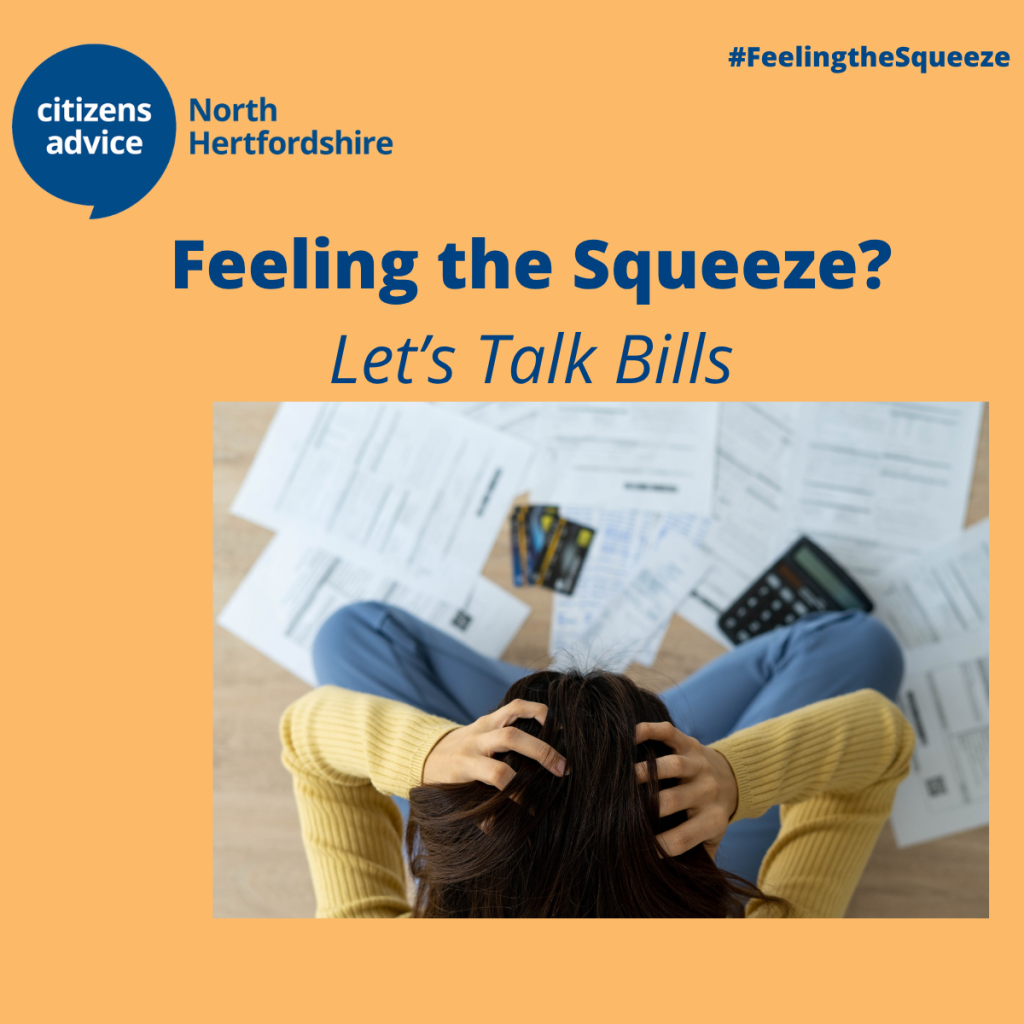 Image of someone holding their hand in their hands looking at a pile of bills.