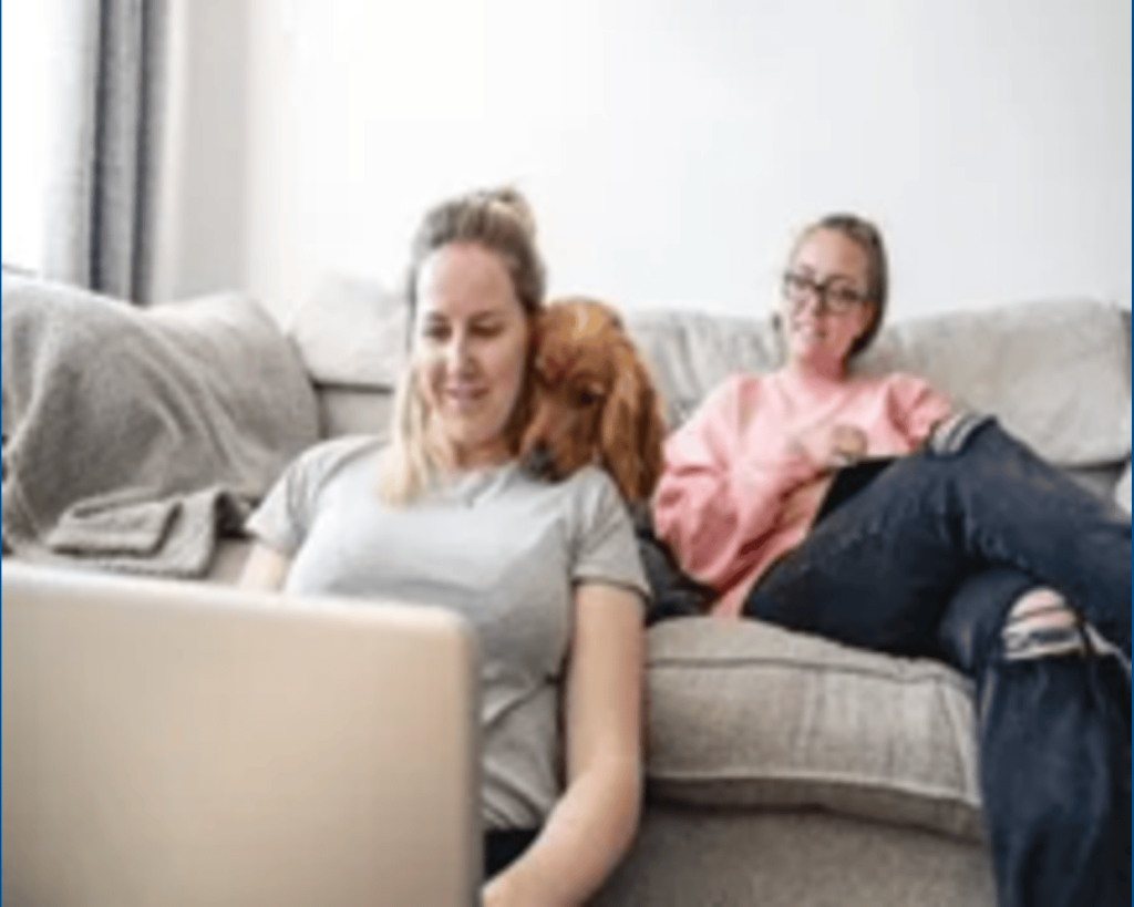 Women looking at Laptop and talking